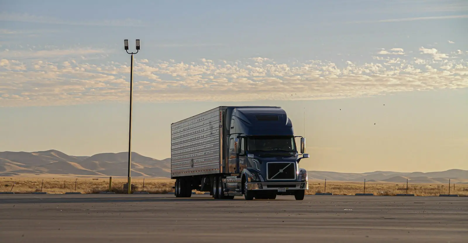 Semi truck with dry van trailer on an open highway
