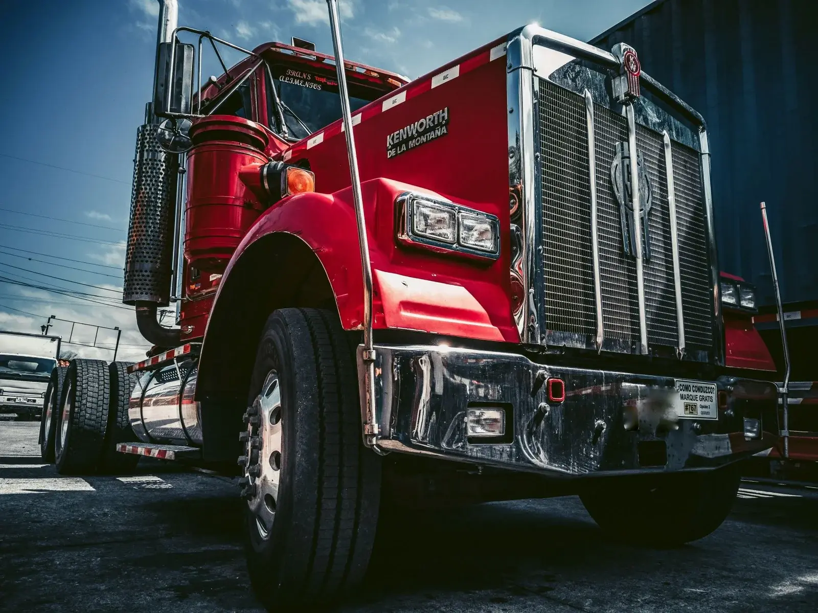 Front of a red Class 8 semi tractor